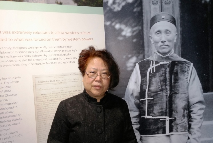 College of Education alumna Carol Huang at 'East Meets West' exhibit at Spurlock Museum in Urbana