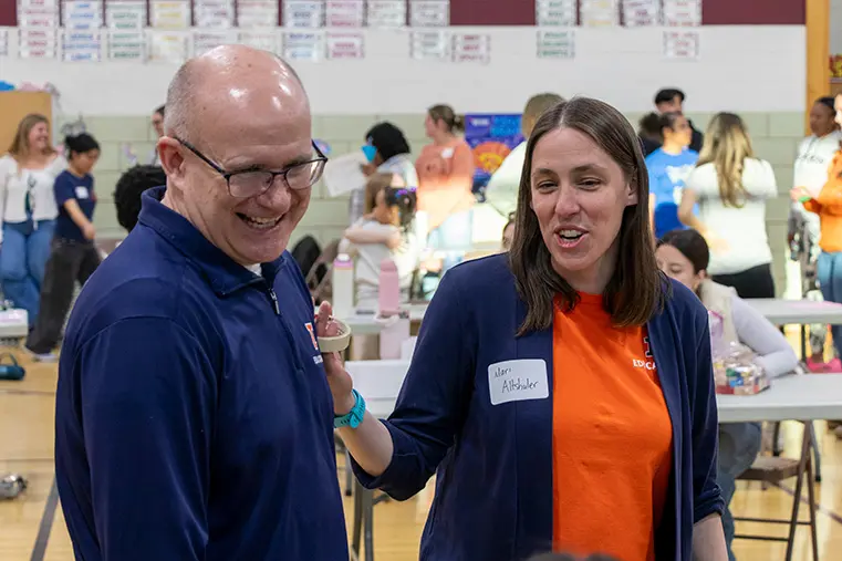 Adam Poetzel and Mari Altshuler talk at family math night