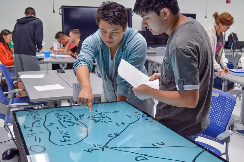 Students working on touchscreens