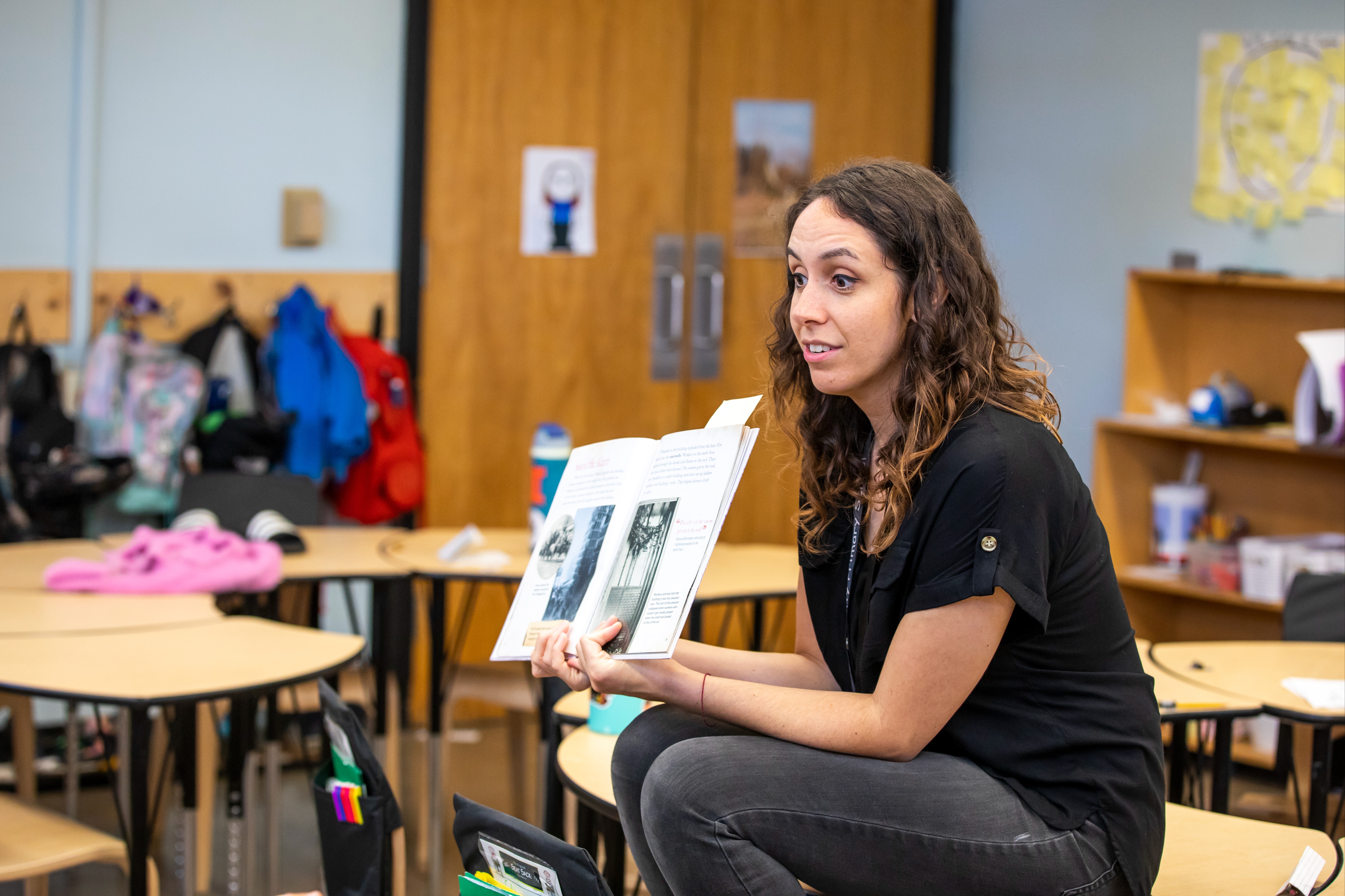 Teacher reading from a book