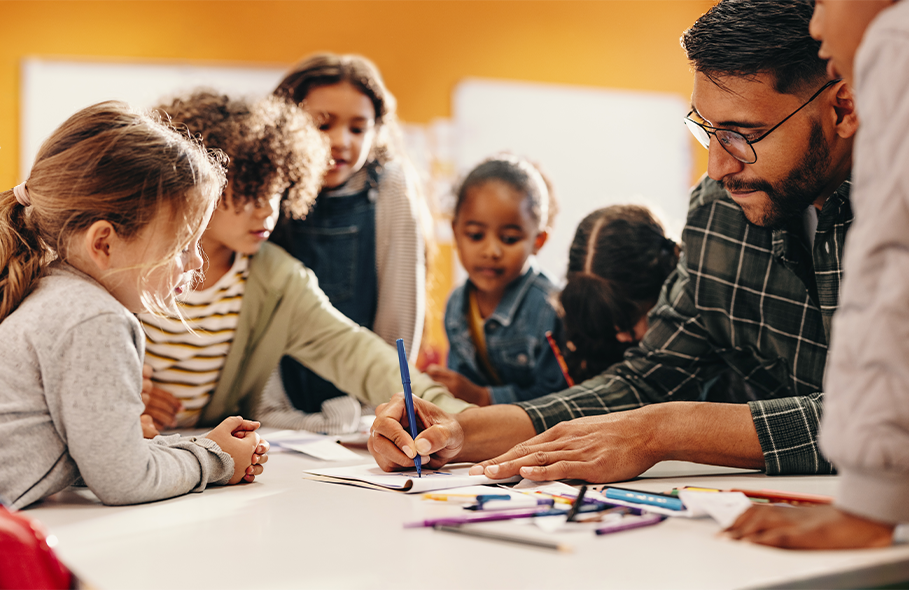 group of diverse young students with teacher