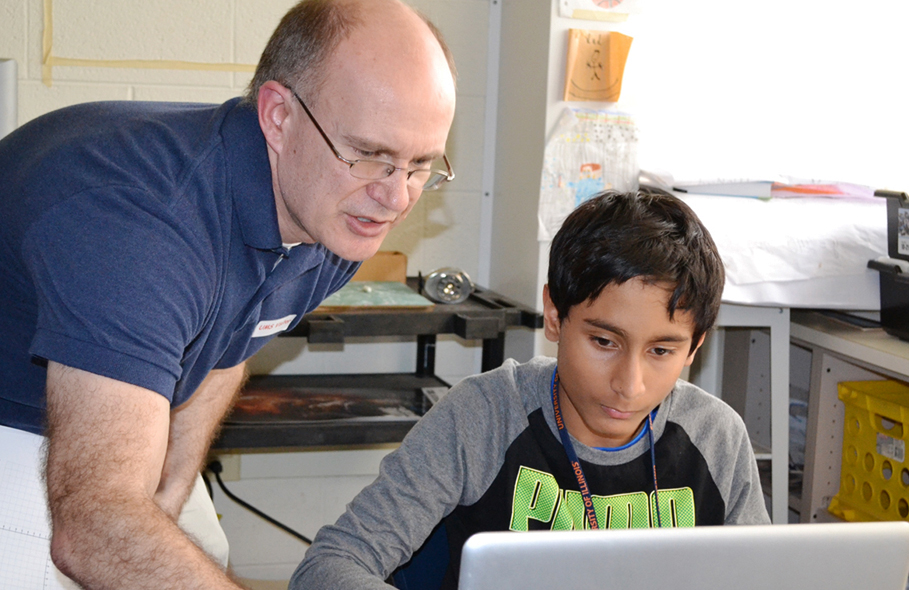 Adam Poetzel and an Urbana Middle School student