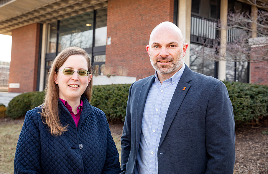Professor Jennifer Delaney and Bradley Hemenway stand outside the College of Education Building