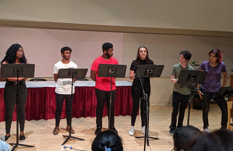 Students perform a play reading at celebration of Gandhi's 150th birthday