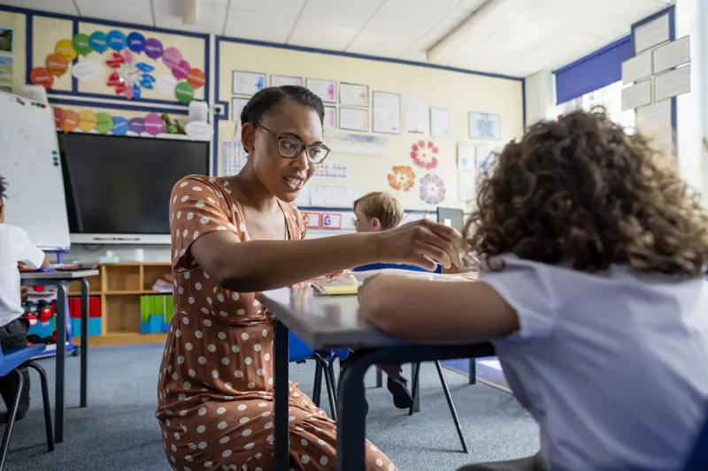 teacher and student in classroom