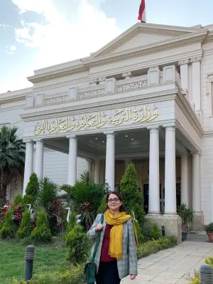 Expanded view of Linda Herrera standing in front of the Egyptian Ministry of Education building