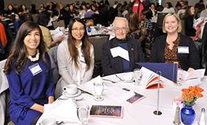 A table of students and donors enjoys the awards ceremony