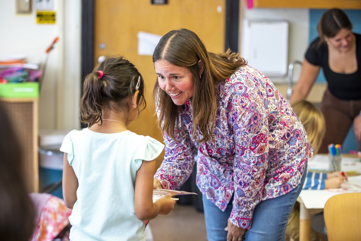 A teacher talking to a student