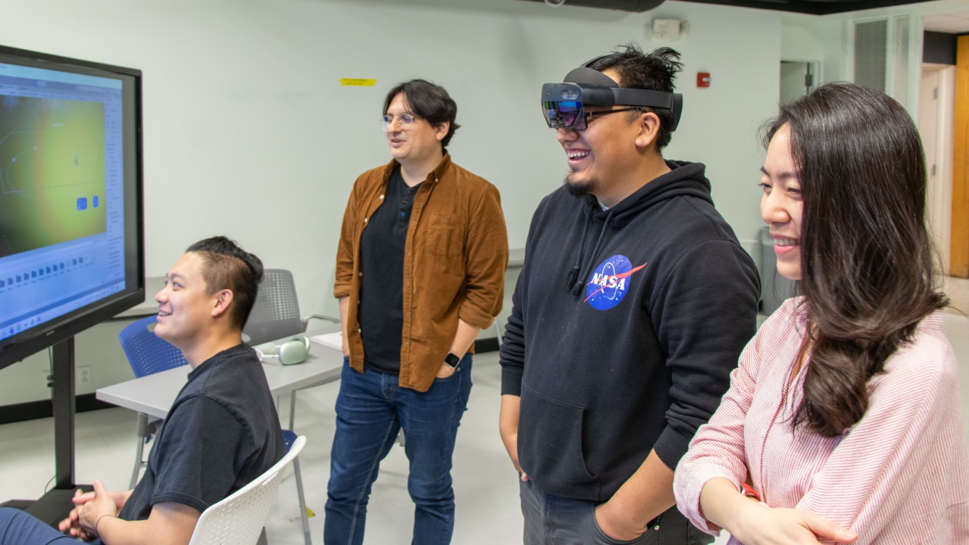 Four students working on a VR related project