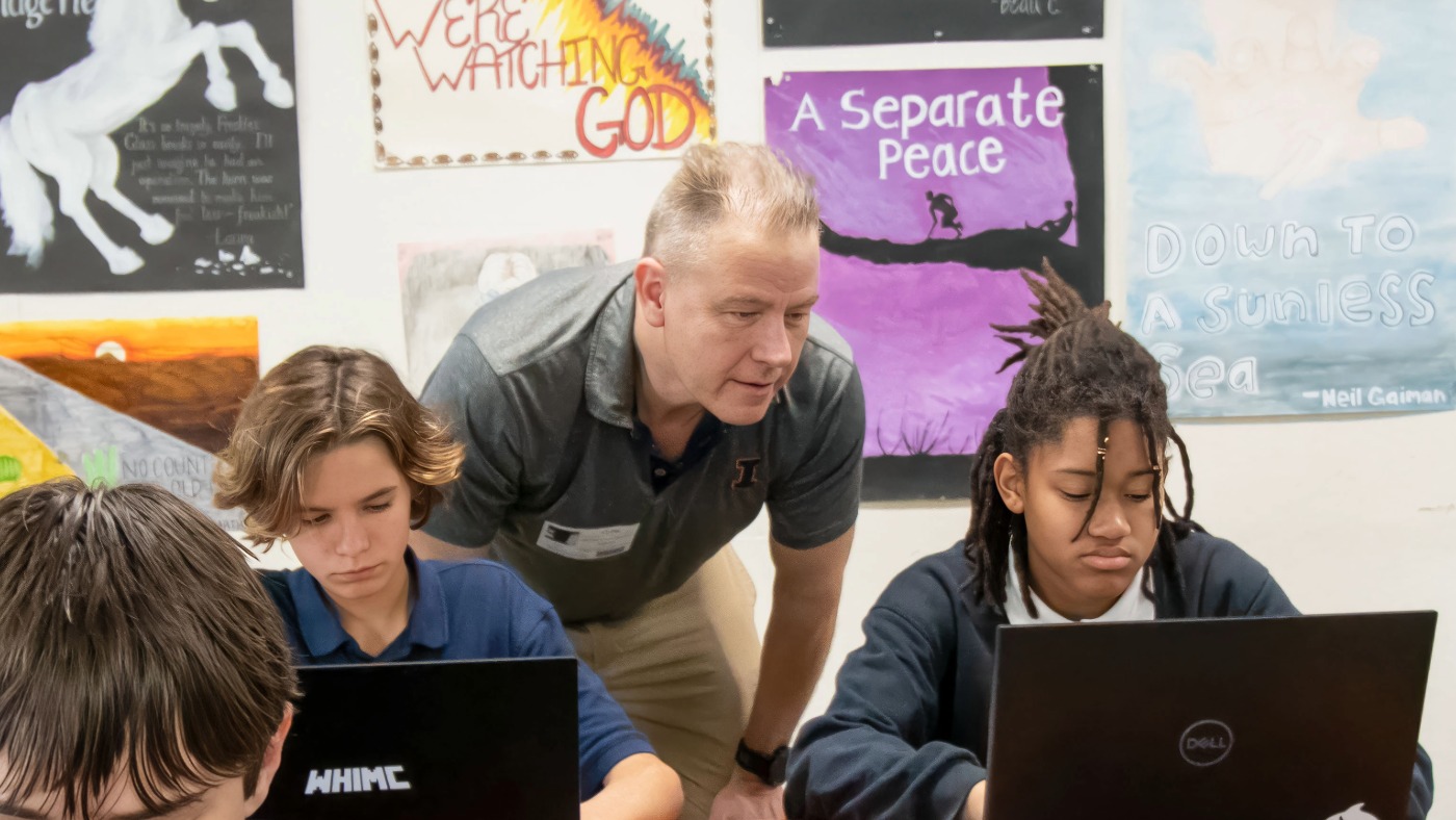 Chad lane works with two students