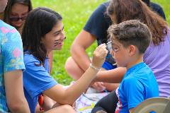 Students from the University Primary School spent the morning playing with summer campers. A favorite activity was face-painting.