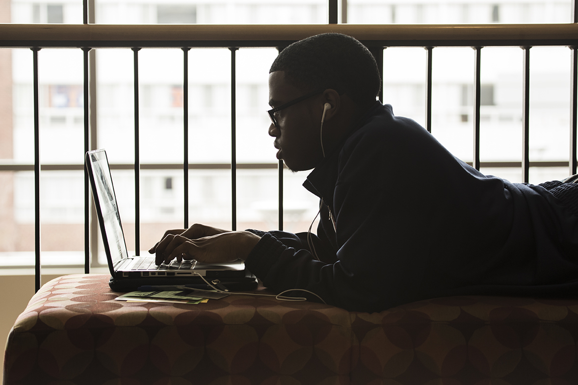 UI-02-140428-492.jpg Student working on laptop.