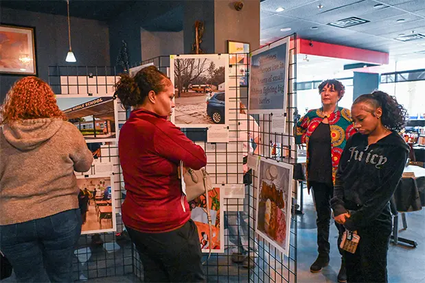 attendees viewing photographs