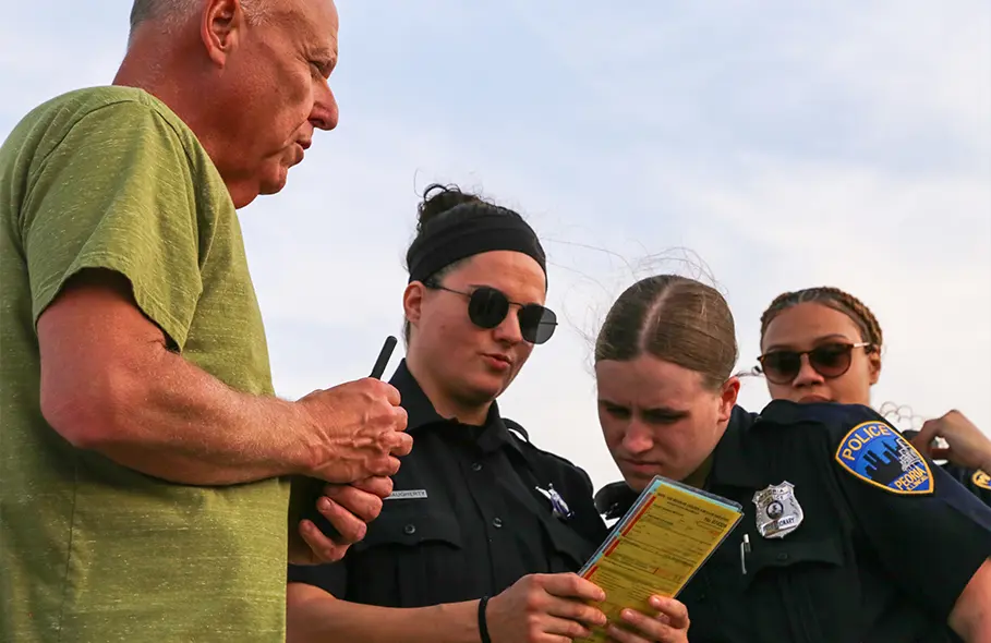 Three police trainees and an instructor at the Police Training Institute