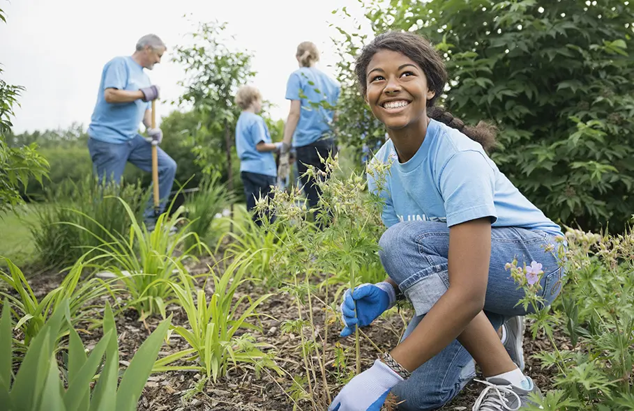 female student gardening