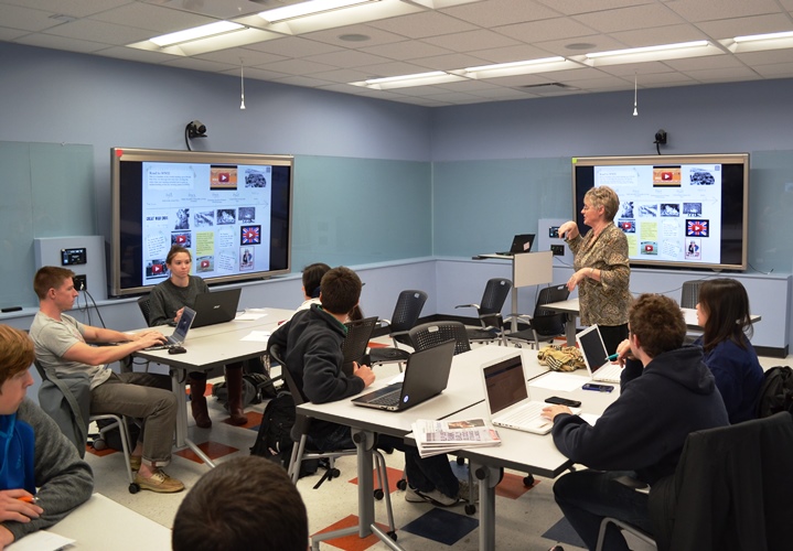 Instructor Lynn Burdick with class in Lab Room of Education Building